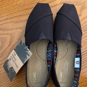 TOMS Black Canvas Slip-ons